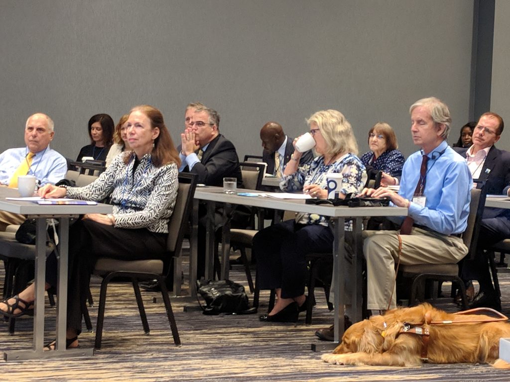 A side view photo of some attendees at the 2018 UAIA event